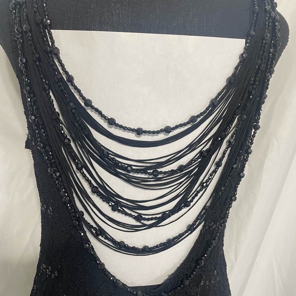Reign On. Black sequin lace formal dress. Beaded back accent. Size 11-12